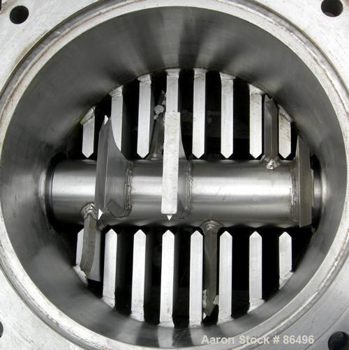 Used Franklin Miller Inline Pipe Delumper, Model PD24, 304 Stainless Steel. Approximate 24" diameter opening, 32" OD mounting flange. 5-1/2" diameter shaft with 9 rotating knives approximately 1" thi...