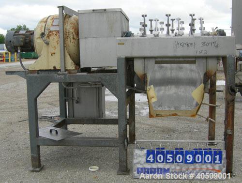 Used Lump Breaker, dual shaft, 304 stainless steel. (1) 4" diameter shaft with (7) 3 blade hook style knives, (1) 4" diameter shaft with (6) 3 blade hook style knives. (2) sets of stationary bars. 40...