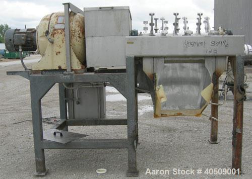 Used Lump Breaker, dual shaft, 304 stainless steel. (1) 4" diameter shaft with (7) 3 blade hook style knives, (1) 4" diameter shaft with (6) 3 blade hook style knives. (2) sets of stationary bars. 40...