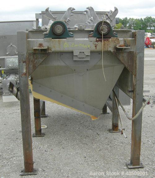 Used Lump Breaker, dual shaft, 304 stainless steel. (1) 4" diameter shaft with (7) 3 blade hook style knives, (1) 4" diameter shaft with (6) 3 blade hook style knives. (2) sets of stationary bars. 40...