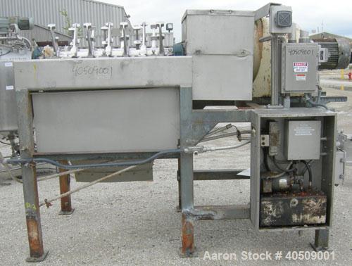 Used Lump Breaker, dual shaft, 304 stainless steel. (1) 4" diameter shaft with (7) 3 blade hook style knives, (1) 4" diameter shaft with (6) 3 blade hook style knives. (2) sets of stationary bars. 40...