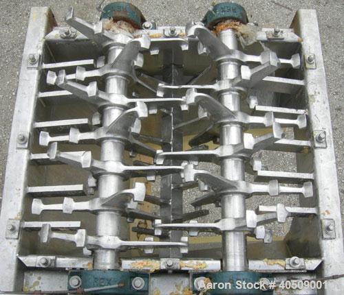 Used Lump Breaker, dual shaft, 304 stainless steel. (1) 4" diameter shaft with (7) 3 blade hook style knives, (1) 4" diameter shaft with (6) 3 blade hook style knives. (2) sets of stationary bars. 40...