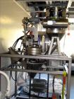 Used Kemutec Kek Pin Mill System, Model 5H. Driven by a 5 hp, 230/460 volt motor. With rotary feeder, dust filter, and discharge hopper. On portable stands with controls. Built 2/2005, serial #A22636.
