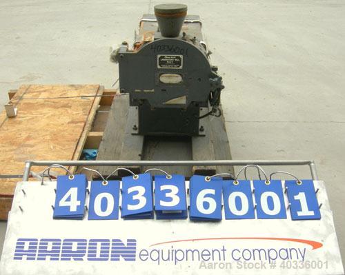 Used Thomas Wiley Cutting Mill, model 4, carbon steel. 141 cubic inch chamber. 7-3/4" diameter x 3" deep 4 bolt on blade rotor. 6 stationary bed knives. Top feed with hopper, bottom discharge. Driven...