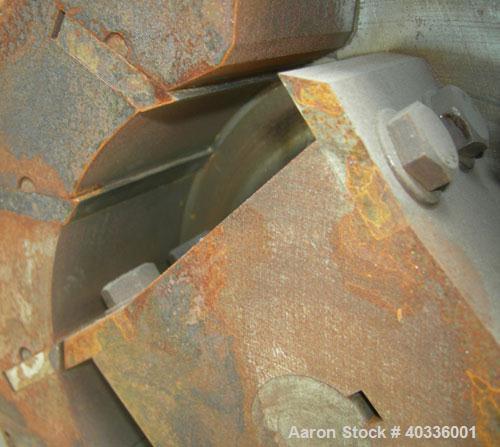 Used Thomas Wiley Cutting Mill, model 4, carbon steel. 141 cubic inch chamber. 7-3/4" diameter x 3" deep 4 bolt on blade rotor. 6 stationary bed knives. Top feed with hopper, bottom discharge. Driven...