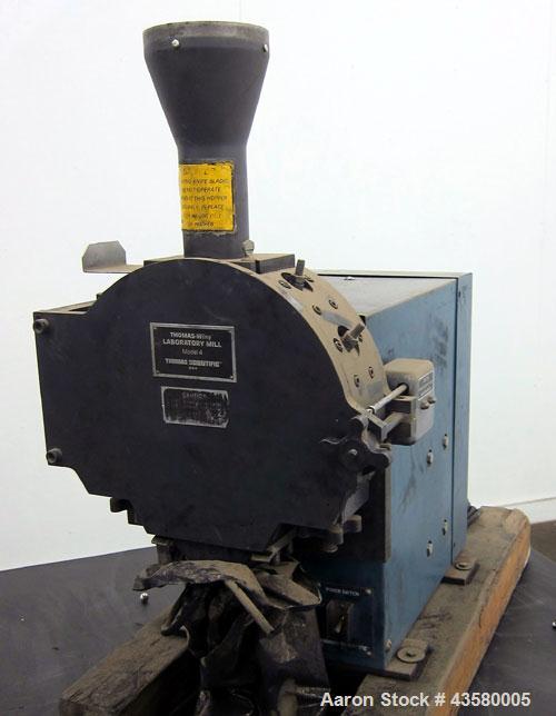 Used Thomas Wiley Cutting Mill, Model 4, Carbon Steel. 141 Cubic inch chamber 7-3/4” diameter x 3” deep. (4) Bolt on blade rotor, 6 stationary bed knives. Top feed with hopper, bottom discharge, hing...