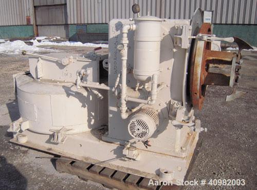 Used California Pellet Mill, Model 7122, carbon steel. Unit includes front hood and conditioner. Missing both motors, die, and rollers.
