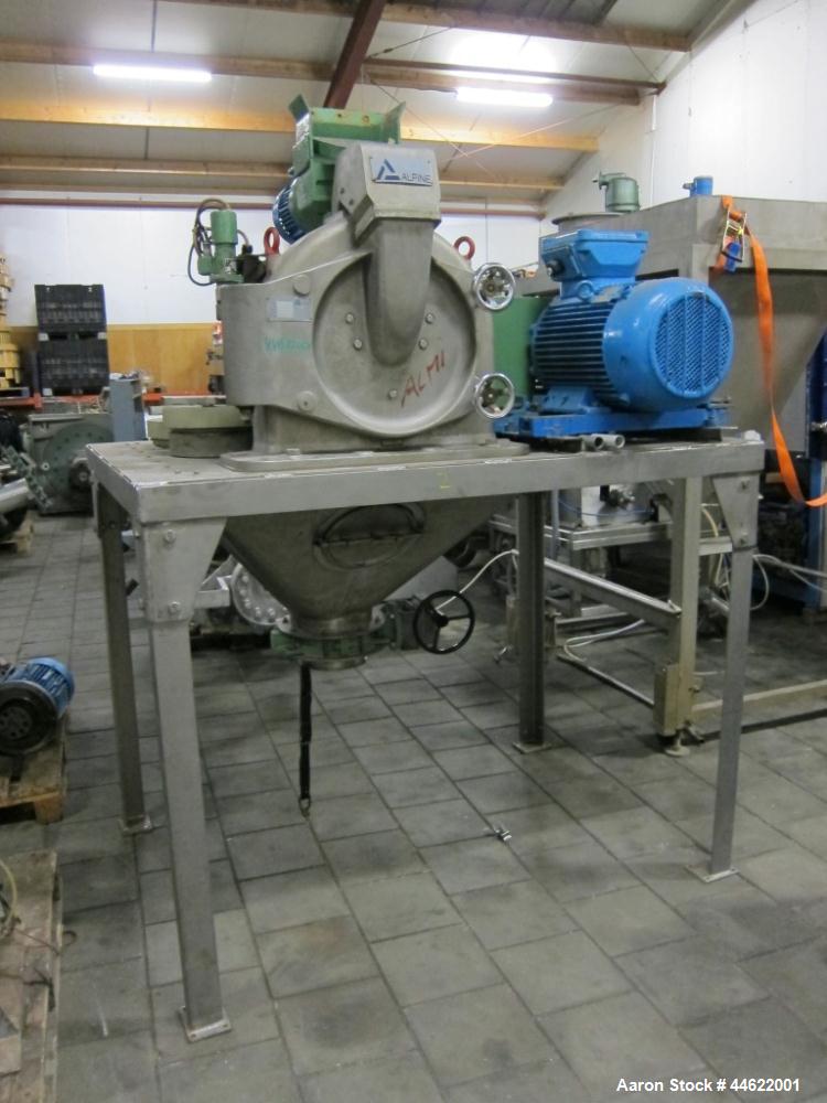 Used Alpine Mill, Model 315UPZ, stainless steel construction. Mill speed 9000 rpm. 29.3 Hp/22 kW motor, 50 Hz, EX. Includes inclined conveyor, hopper and technical documentation. New 1986. Frame moun...