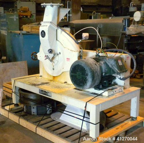 Used Bauermeister Universal Mill, Model UT22, Carbon Steel. Approximately 18-1/2" diameter x  6" deep sieve ring assembly, Approximately 17-1/2" diameter revolving rotor. Hinged front door with a top...
