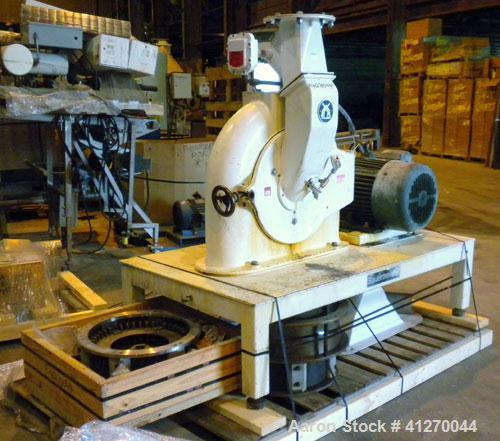 Used Bauermeister Universal Mill, Model UT22, Carbon Steel. Approximately 18-1/2" diameter x  6" deep sieve ring assembly, Approximately 17-1/2" diameter revolving rotor. Hinged front door with a top...