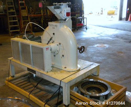 Used Bauermeister Universal Mill, Model UT22, Carbon Steel. Approximately 18-1/2" diameter x  6" deep sieve ring assembly, Approximately 17-1/2" diameter revolving rotor. Hinged front door with a top...