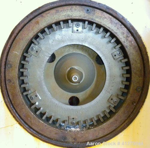 Used Bauermeister Universal Mill, Model UT22, Carbon Steel. Approximately 18-1/2" diameter x  6" deep sieve ring assembly, Approximately 17-1/2" diameter revolving rotor. Hinged front door with a top...