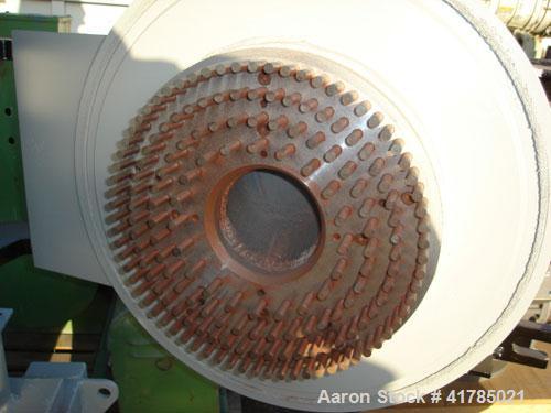 Used Gruber Hermanos 24-AP pan mill, cast iron, duplex 24-AP and sic mill, 14.2" (360 mm), diameter rotor with 4 rows of 0.4" (10 mm) diameter pins, reduced down to 0.24" (6 mm) pitch with feed hoppe...