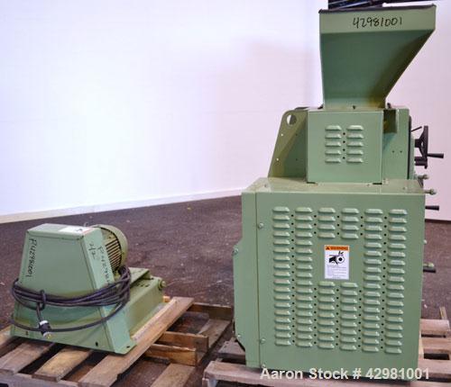 Used CPM Roskamp Series 900 Roller Mill, Type DP900-12, Carbon Steel.  (2) Pairs of  9’’ diameter x 12’’ wide rolls. Manually adjustable.  Manual feed gate adjustment, top feed hopper.  Driven by a 1...