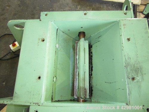 Used CPM Roskamp Series 900 Roller Mill, Type DP900-12, Carbon Steel.  (2) Pairs of  9’’ diameter x 12’’ wide rolls. Manually adjustable.  Manual feed gate adjustment, top feed hopper.  Driven by a 1...