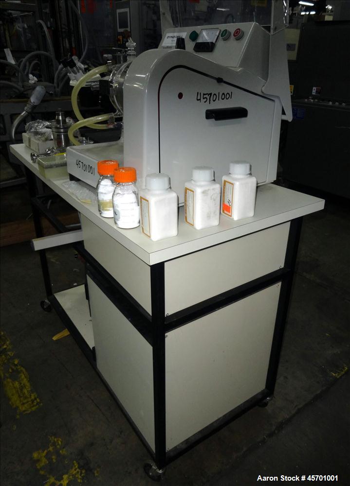 Used Dyno Mill Laboratory Mill, Model Type KDL, Horizontal. Approximately 0.3 liter glass grinding chamber, approximately 6" diameter x 2-1/4" deep. Has approximately 3.77" diameter polyurethane agit...