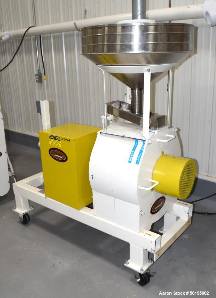 Used Meadows Mills Stone Burr Mill, Model 20N, Carbon Steel. Includes a feed hopper. Driven by a 10hp motor. Set up with blower discharge. Mounted on a frame with casters. Serial# 34523-13.  ADD 18% ...