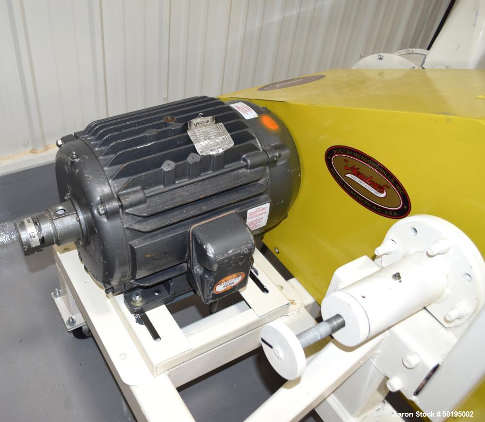 Used Meadows Mills Stone Burr Mill, Model 20N, Carbon Steel. Includes a feed hopper. Driven by a 10hp motor. Set up with blower discharge. Mounted on a frame with casters. Serial# 34523-13.  ADD 18% ...