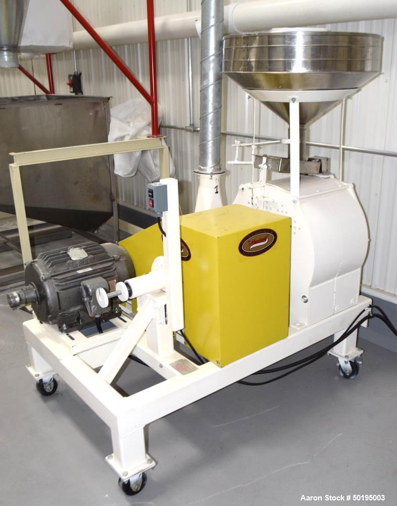 Used Meadows Mills Stone Burr Mill, Model 20N, Carbon Steel. Includes a feed hopper. Driven by a 10hp motor. Set up with blower discharge. Mounted on a frame with casters. Serial# 34521-13.  ADD 18% ...