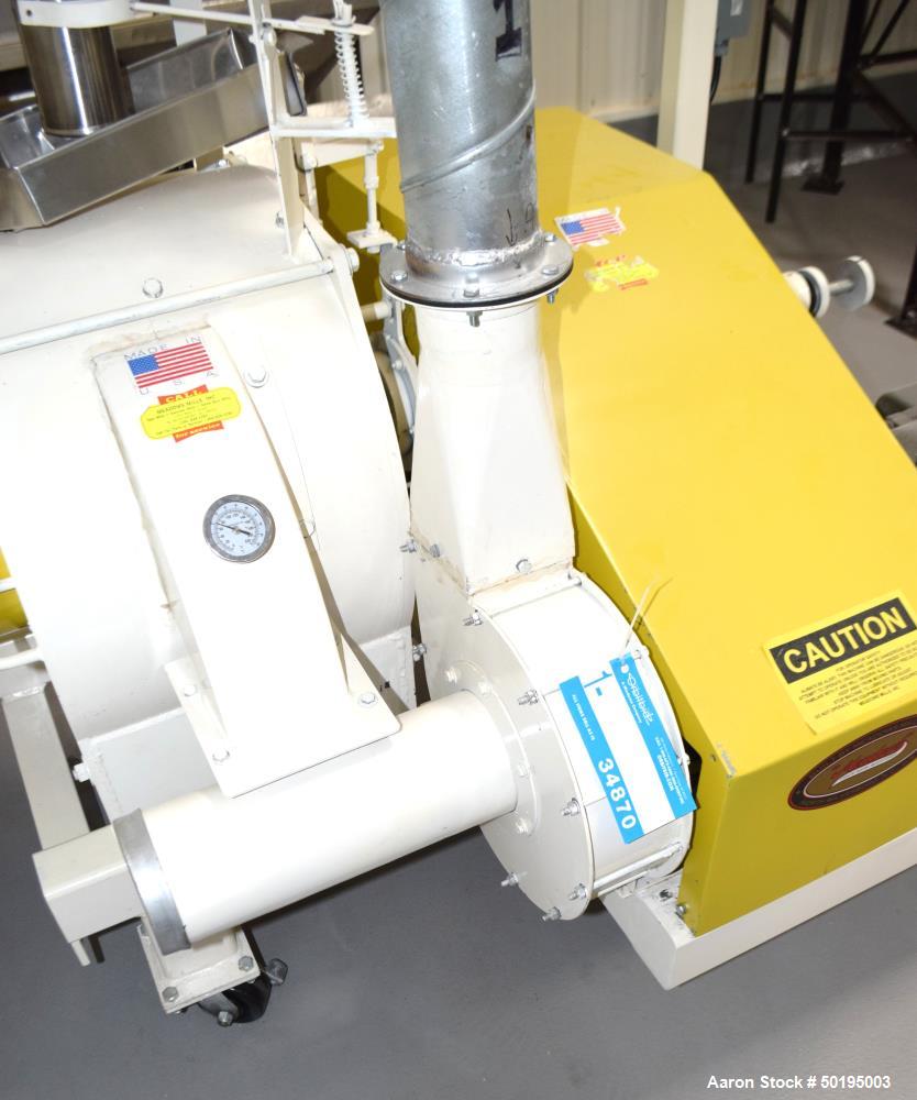 Used Meadows Mills Stone Burr Mill, Model 20N, Carbon Steel. Includes a feed hopper. Driven by a 10hp motor. Set up with blower discharge. Mounted on a frame with casters. Serial# 34521-13.  ADD 18% ...