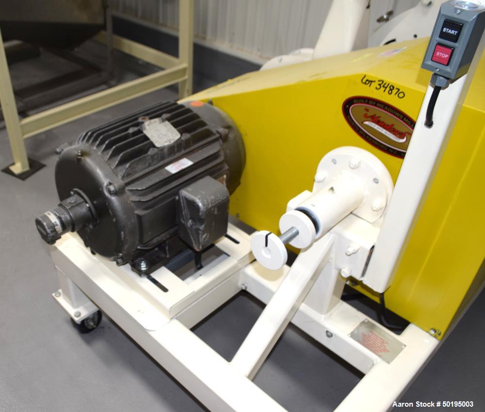 Used Meadows Mills Stone Burr Mill, Model 20N, Carbon Steel. Includes a feed hopper. Driven by a 10hp motor. Set up with blower discharge. Mounted on a frame with casters. Serial# 34521-13.  ADD 18% ...