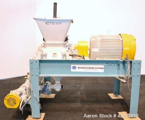 Used Micron Powder Systems Mikro Pulverizer Hammer Mill, Model 4SCB, Carbon Steel. 20" Diameter x 12" wide rotor with 4 rows swinging stirrup hammers. Top gravity feed hopper, no bottom screen. Botto...