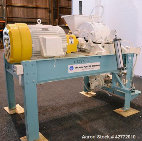 Used Micron Powder Systems Mikro Pulverizer Hammer Mill, Model 4SCB, Carbon Steel. 20" Diameter x 12" wide rotor with 4 rows swinging stirrup hammers. Top gravity feed hopper, no bottom screen. Botto...