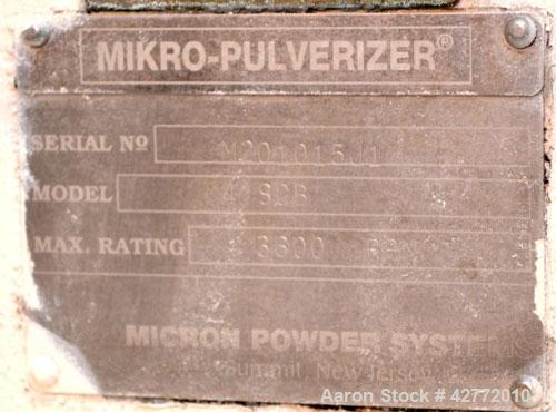 Used Micron Powder Systems Mikro Pulverizer Hammer Mill, Model 4SCB, Carbon Steel. 20" Diameter x 12" wide rotor with 4 rows swinging stirrup hammers. Top gravity feed hopper, no bottom screen. Botto...