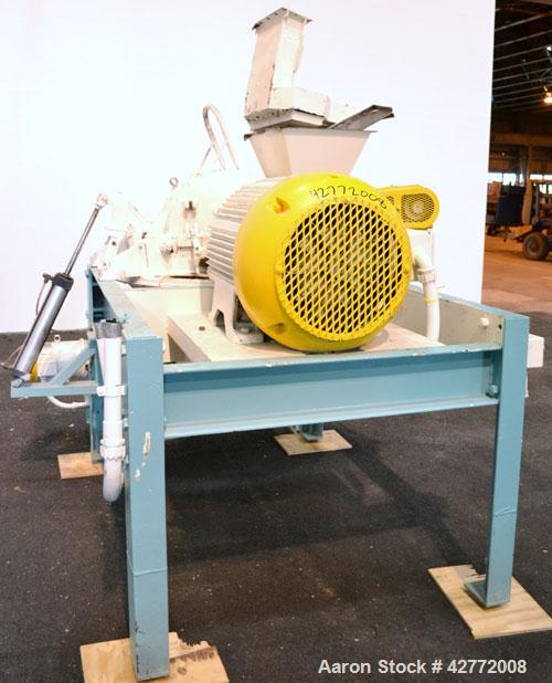Used Mikro Pulverizer Hammer Mill, Model 4TH, Carbon Steel. 20" Diameter x 12" wide rotor with 4 rows swinging stirrup hammers. Top feed hopper with a triple screw feed, driven by a 2 hp, 3/60/460 vo...