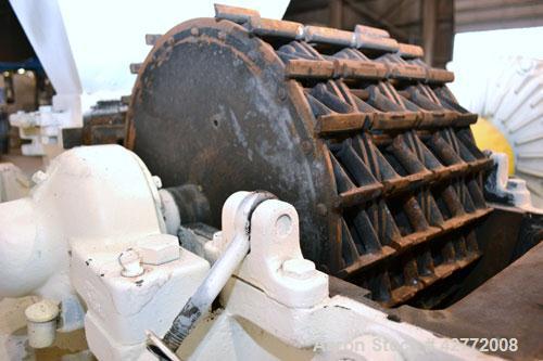 Used Mikro Pulverizer Hammer Mill, Model 4TH, Carbon Steel. 20" Diameter x 12" wide rotor with 4 rows swinging stirrup hammers. Top feed hopper with a triple screw feed, driven by a 2 hp, 3/60/460 vo...