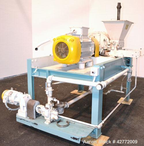 Used Mikro Pulverizer Hammer Mill, Model 4TH, Carbon Steel. 20" Diameter x 12" wide rotor with 4 rows swinging stirrup hammers. Top feed hopper with a triple screw feed, driven by a 2 hp, 3/60/460 vo...