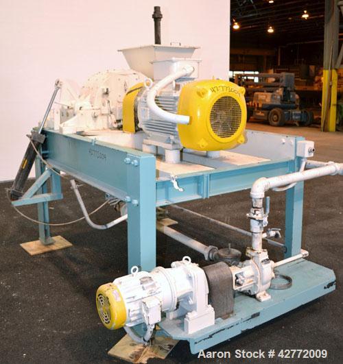 Used Mikro Pulverizer Hammer Mill, Model 4TH, Carbon Steel. 20" Diameter x 12" wide rotor with 4 rows swinging stirrup hammers. Top feed hopper with a triple screw feed, driven by a 2 hp, 3/60/460 vo...