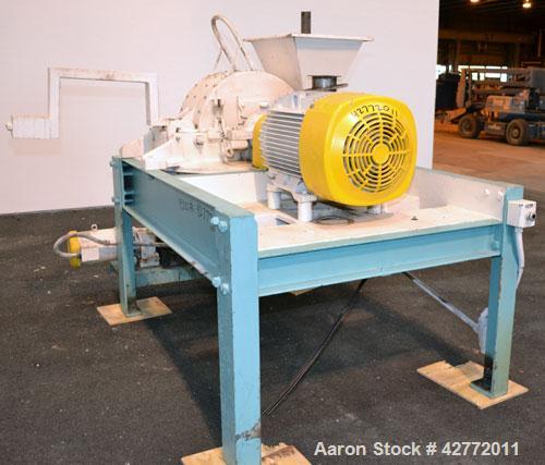 Used Mikro Pulverizer Hammer Mill, Model 4TH, Carbon Steel. 20" Diameter x 12" wide rotor with 4 rows swinging stirrup hammers. Top gravity feed hopper, bottom screen. Bottom discharge hopper with a ...