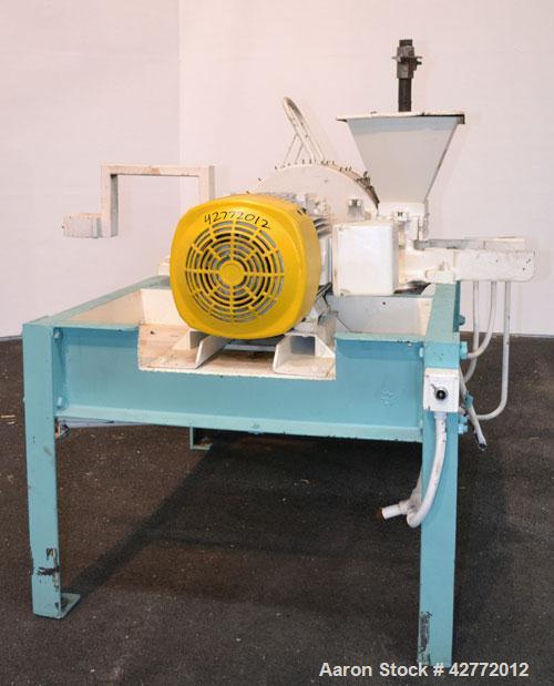Used Mikro Pulverizer Hammer Mill, Model 4TH, Carbon Steel. 20" Diameter x 12" wide rotor with 4 rows swinging stirrup hammers. Top gravity feed hopper, bottom screen. Bottom discharge hopper with a ...