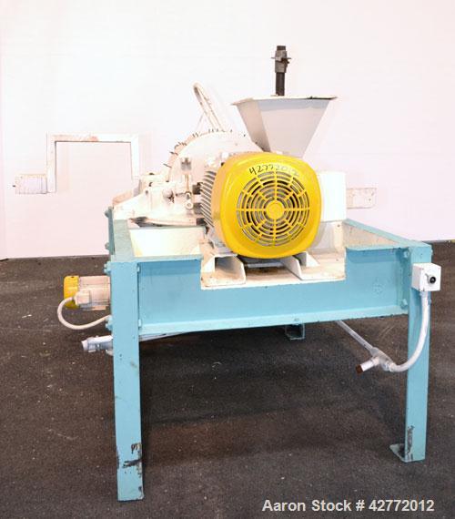 Used Mikro Pulverizer Hammer Mill, Model 4TH, Carbon Steel. 20" Diameter x 12" wide rotor with 4 rows swinging stirrup hammers. Top gravity feed hopper, bottom screen. Bottom discharge hopper with a ...