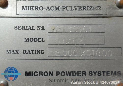 Used Micron Powder Systems Air Classifying Mill, Model 60ACM, Carbon Steel. Approximate 30’’ diameter grinding chamber. Maximum rotor speed 3000 rpm, driven by a 125hp, 3/60/460 volt, 1780 rpm motor....