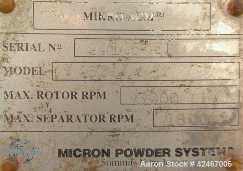Used Micron Powder Systems Air Classifying Mill, Model 60ACM, Carbon Steel. Approximate 30’’ diameter grinding chamber. Maximum rotor speed 3000 rpm, driven by a 125hp, 3/60/460 volt, 1780 rpm motor....