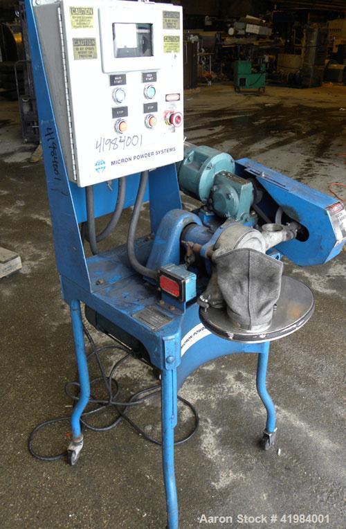 Used Micron Powder Systems Mikro Bantam Pulverizer Hammer Mill, Model 611072EX, 304 Stainless Steel. Approximate 5-1/4" diameter x 1-1/2" deep chamber with (6) swinging stirrup hammers. 1’’ diameter ...