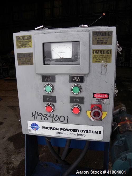 Used Micron Powder Systems Mikro Bantam Pulverizer Hammer Mill, Model 611072EX, 304 Stainless Steel. Approximate 5-1/4" diameter x 1-1/2" deep chamber with (6) swinging stirrup hammers. 1’’ diameter ...