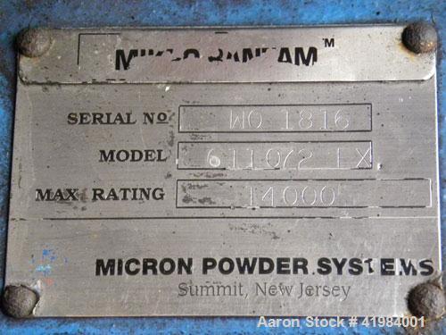 Used Micron Powder Systems Mikro Bantam Pulverizer Hammer Mill, Model 611072EX, 304 Stainless Steel. Approximate 5-1/4" diameter x 1-1/2" deep chamber with (6) swinging stirrup hammers. 1’’ diameter ...