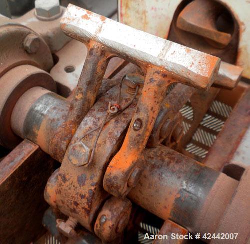 Used Mikro Pulverizer Hammer Mill, model 1SH, carbon steel. Approximate 8" diameter x 3-1/2" deep chamber with (6) 3’’ wide swinging stirrup hammers. Single screw feed, driven by a 1/4 hp, 90 volt, 1...