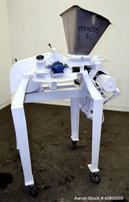 Used Mikro Pulverizer Hammer Mill, Model 1SH, 304 Stainless Steel. Approximately 8" diameter x 3-1/2" deep chamber with (6) 3” wide swinging stirrup hammers. Single screw feed, driven by a 1/2 hp, 3/...