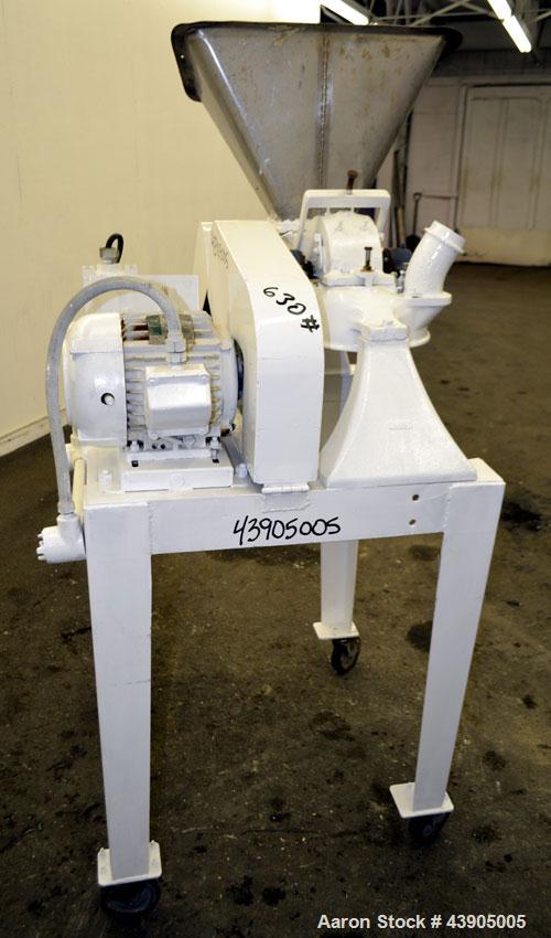 Used Mikro Pulverizer Hammer Mill, Model 1SH, 304 Stainless Steel. Approximately 8" diameter x 3-1/2" deep chamber with (6) 3” wide swinging stirrup hammers. Single screw feed, driven by a 1/2 hp, 3/...