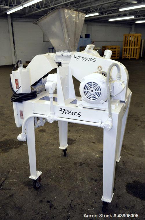 Used Mikro Pulverizer Hammer Mill, Model 1SH, 304 Stainless Steel. Approximately 8" diameter x 3-1/2" deep chamber with (6) 3” wide swinging stirrup hammers. Single screw feed, driven by a 1/2 hp, 3/...