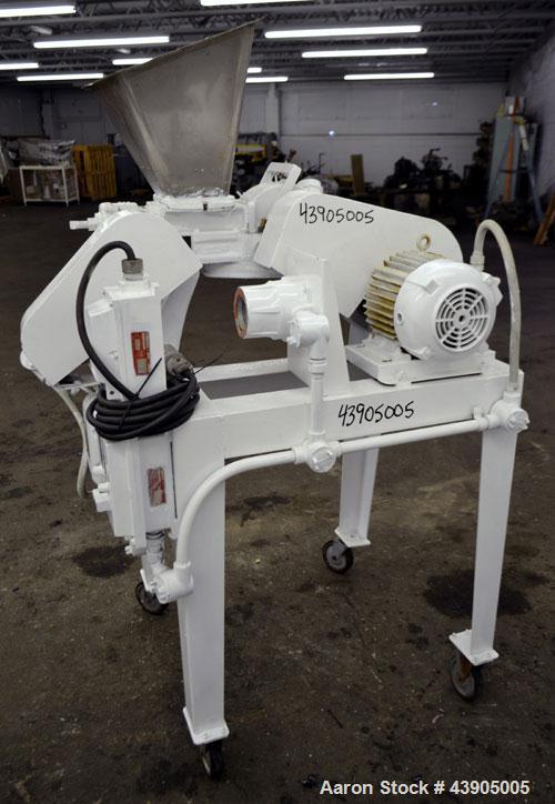 Used Mikro Pulverizer Hammer Mill, Model 1SH, 304 Stainless Steel. Approximately 8" diameter x 3-1/2" deep chamber with (6) 3” wide swinging stirrup hammers. Single screw feed, driven by a 1/2 hp, 3/...