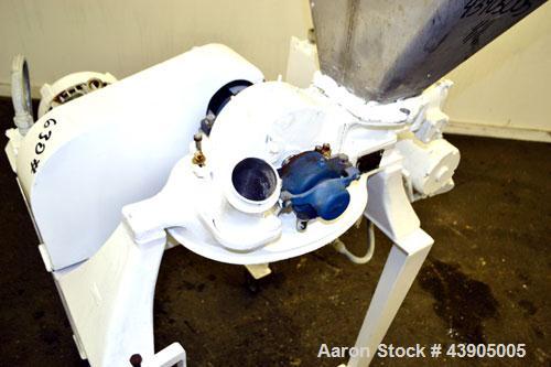Used Mikro Pulverizer Hammer Mill, Model 1SH, 304 Stainless Steel. Approximately 8" diameter x 3-1/2" deep chamber with (6) 3” wide swinging stirrup hammers. Single screw feed, driven by a 1/2 hp, 3/...