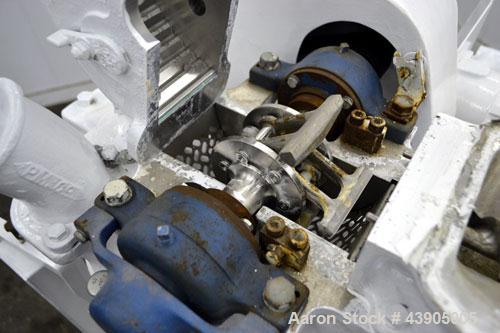Used Mikro Pulverizer Hammer Mill, Model 1SH, 304 Stainless Steel. Approximately 8" diameter x 3-1/2" deep chamber with (6) 3” wide swinging stirrup hammers. Single screw feed, driven by a 1/2 hp, 3/...