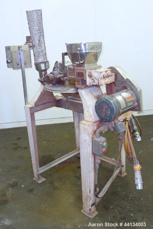 Used Mikro Pulverizer Hammer Mill, Model 1SH, 304 Stainless Steel. Approximately 8" diameter x 3-1/2" deep chamber with (6) 3” wide swinging stirrup hammers. Dual screw feed with hopper, driven by a ...