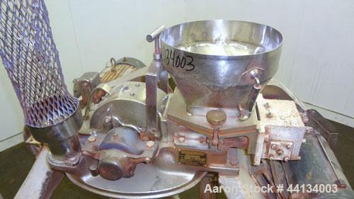Used Mikro Pulverizer Hammer Mill, Model 1SH, 304 Stainless Steel. Approximately 8" diameter x 3-1/2" deep chamber with (6) 3” wide swinging stirrup hammers. Dual screw feed with hopper, driven by a ...