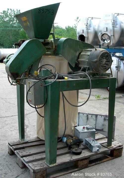 USED: Mikro Pulverizer Model 1SH, carbon steel. Approximate 6" diameter rotor with (6) 3" wide swinging stirrup hammers. 1-1/2" diameter x 8" long screw feed with hopper, driven by a 1/3 hp, 1/60/115...